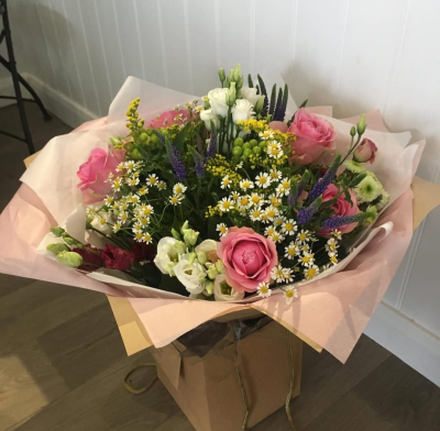 Ashleigh - A budding delight, complimented by greenery and presented in a gift box/bag. Beautiful flower bouquet hand delivered by the local florist.