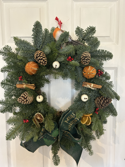 Christmas Wreath - Beautifully decorated Christmas wreath, festive and fragrant. Finished with a traditional green ribbon.