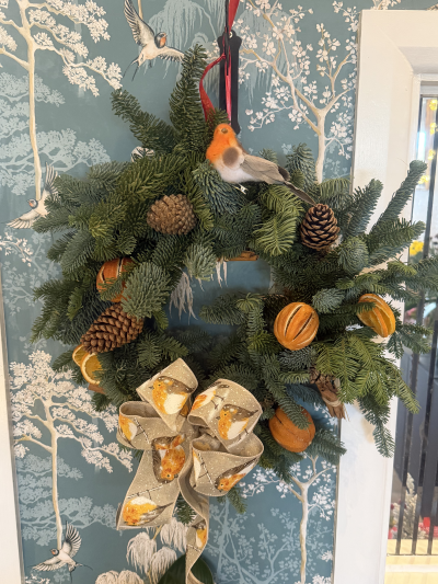 Christmas Wreath - Beautifully decorated Christmas wreath. Festive and fragrant. Finished with a pretty robin ribbon.